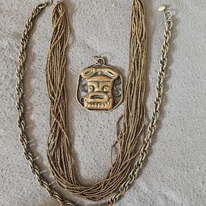 Elegant Gold Necklace with Tribal Pendant